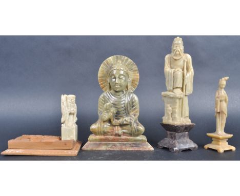 A collection of four Chinese jade / soapstone figurines comprising a figure of Guanyin, Elder with foot on pedestal base, Bud