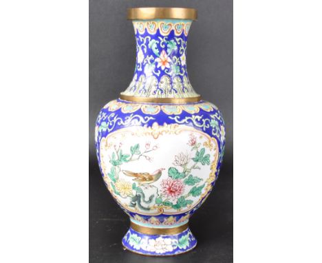 An early 20th Century Chinese Canton enamel vase. Hand painted decoration depicting birds and flowers with repeating scrolls,
