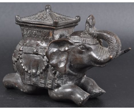 An early 20th Century Indian bronze / metal censer figural prayer pot / betel box in the form an elephant. Pagoda top with ca