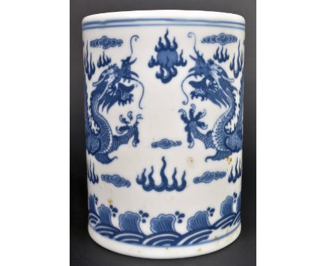 A 20th Century Chinese Republic period hand painted blue and white porcelain vase / brush pot. Cylindrical form with scenes o