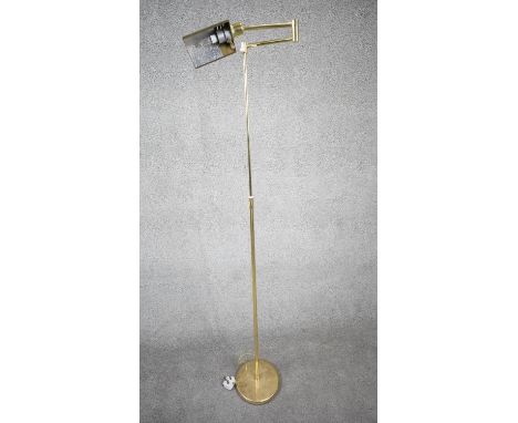 A 1970's Holtkoetter pharmacy brass floor lamp designed and made in Germany by Holtkoetter Leuchten Co., with adjustable heig