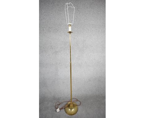 A vintage solid brass candle design height adjustable standard lamp with ridged weighted circular base. With silk wrapped cor
