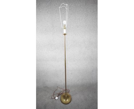 A vintage solid brass candle design height adjustable standard lamp with ridged circular base. H.172 