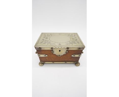 A Victorian silver plated and oak tea caddy, in the form of a strapped chest with silver plated brackets, handles and lid on 