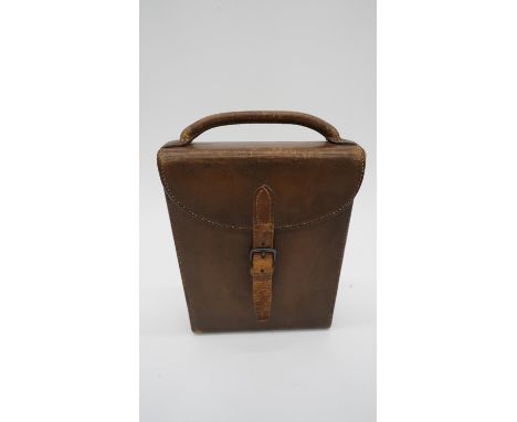 An antique tan leather cased James Dixon &amp; Sons hunting saddle canteen set. Comprising of locking silver plate whisky fla