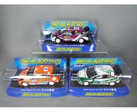 Scalextric - 3 x Ford Focus RS WRC models including two Eddie Stobart liveried cars and a 2010 Rally Sweden car. # C2883, # C