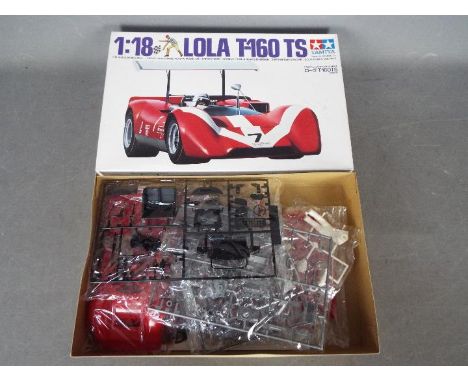 Tamiya - A boxed 1:18 scale Tamiya #10004 Lola T-160 TS plastic model kit. The kit appears to have parts on sprues in Factory