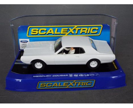 Scalextric - A 1967 Mercury Cougar in plain white finish. # C3443TF. The car appears in Mint condition in a Very Good display
