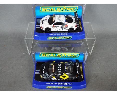 Scalextric - 2 x Audi R8 LMS models in Phoenix Racing liveries. # C3378, # C3386. The models both appear Mint in Very Good di