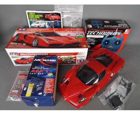 Tamiya - An assembled and boxed Tamiya #58302 1:10 scale R/C Enzo Ferrari 4WD High Performance Racing Car. The assembled mode