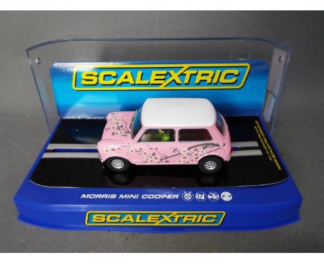 Scalextric - A limited edition Morris Mini Cooper in pink. C3224. This car is number 1301 of only 1500 produced and appears i