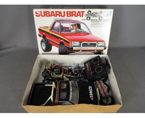 Tamiya - An assembled and boxed vintage 1983 release Tamiya #58038 1:10 scale R/C Subaru Brat Off-Road Pick Up. The assembled