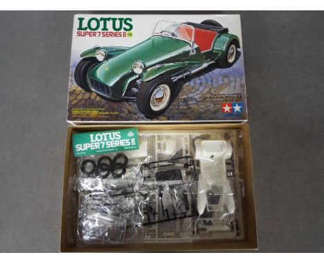 Tamiya - A boxed vintage 1984 Tamiya #24046 1:24 scale Lotus Super 7 Series II 1500 Cosworth plastic model kit. The kit appea