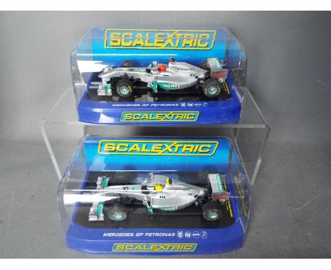 Scalextric - 2 x 2011 Mercedes GP Petronas F1 cars, number 7 Schumacher car and number 8 Rossberg car. # C3167, # C3168. Both