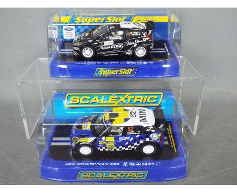 Scalextric - Superslot - 2 x cars, A 2012 Rally Sweden Mini Countryman WRC and a Ford Fiesta WRC Abu Dhabi car. # C3401, # H3