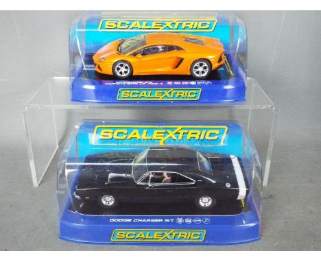 Scalextric - 2 x cars, a 1969 Dodge Charger R/T in black and a Lamborghini Aventador LP 700-4 in orange. # C3218, # C3460. Bo