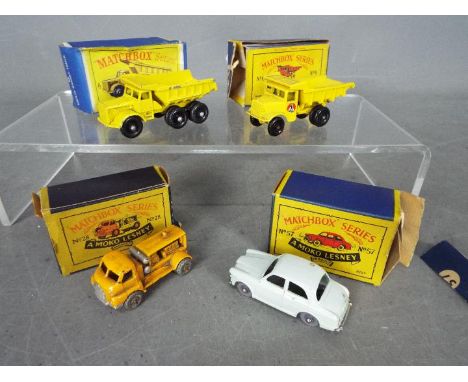 Matchbox, Lesney - Four boxed diecast model vehicles by Matchbox. Lot includes Matchbox #6 Euclid Quarry Truck (in B5 Moko Le