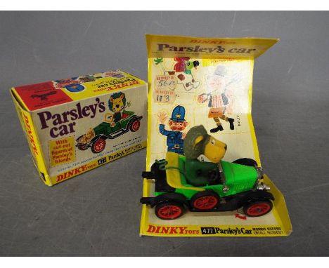 Dinky Toys - A boxed Dinky Toys #447 Parsley's Car 'Bull Nose Morris'. This 1970's diecast in green, black and yellow appears