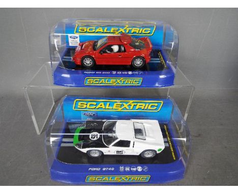 Scalextric - 2 x Ford cars, a GT40 model as driven by Mark Donohue in the 1966 Daytona and an RS200 in red from the Collector