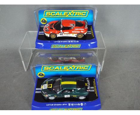 Scalextric - 2 x Lotus Evora models, a red, gold and white race car and a limited edition GT4 in green and yellow. # C3379, #