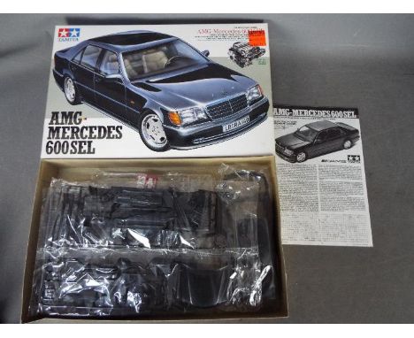 Tamiya - A boxed 1993 released Tamiya 1:24 scale #24128 Sports Car Series' AMG Mercedes 600 SEL plastic model kit. The kit ap