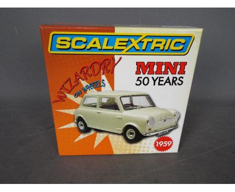 Scalextric - A limited edition Mini 50th Anniversary model. # C2980A. It is number 698 of 4000 produced and appears Mint in a