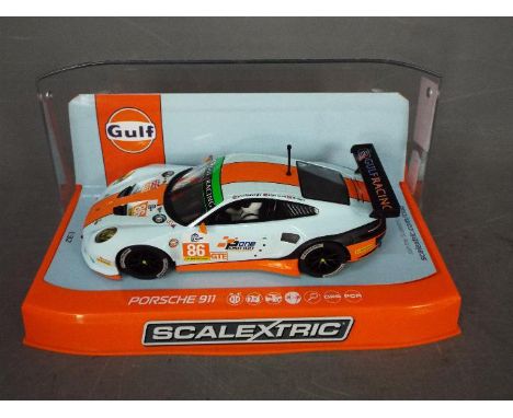 Scalextric - Rare 2015 Porsche 911 Gulf Racing Team car number 86 from the Silverstone 4 hour race. # C3732. The car appears 