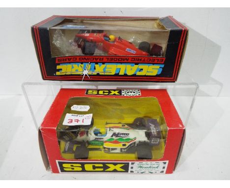 Scalextric -  a Scalextric Ferrari F1  #C.457 and an SCX Formula 3000 'M-2000' #83510, both unchecked for completeness and bo