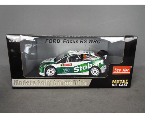 Sun Star - A boxed 1:18 scale Sun Satr 'Modern Rally Collectibles' #3916 Ford Focus RS WRC M.Wilson / M.Orr Wales Rally GB 20