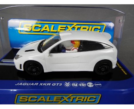 Scalextric - An unusual Ford Focus WRC model in plain white with several differences to the standard model including no black