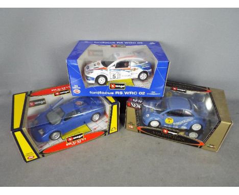 Bburago - Three boxed diecast 1:18 scale model cars from Bburago. Lot includesFord Focus RS WRC 02; Volkswagen New Beetle Cup