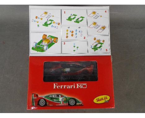 Slot-it - A Ferrari F40 self assembly model kit # KF02C  The model appears Mint and the parts are still sealed in bags. The b