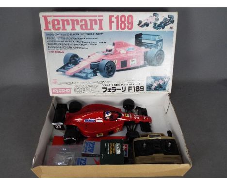 Kyosho - An assembled and boxed Kyosho #4201 1:10 scale R/C Ferrari F189 F1 Racer. The model shows signs of use, generally ap