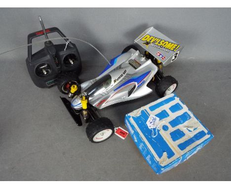 Tamiya - An assembled and unboxed Tamiya 1:10 scale RC 'Manta Ray' High Performance Off Road Racer. The model shows signs of 