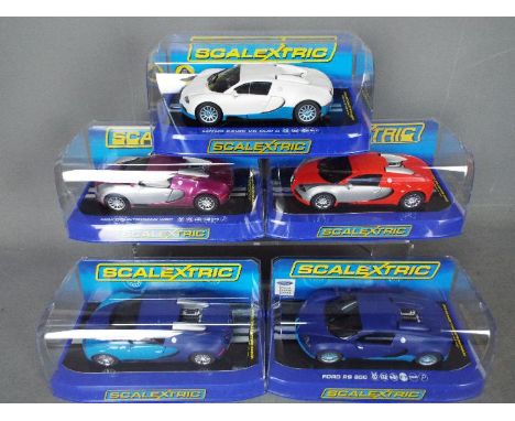 Scalextric - 5 x Bugatti Veyron models in various colours, the cars appear in Mint condition in incorrect display cases, one 