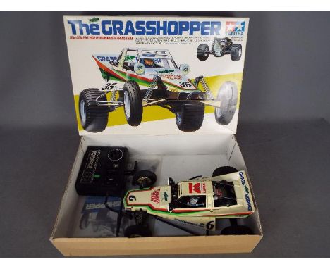 Tamiya - An assembled and boxed vintage 1984 release Tamiya #58043 1:10 scale R/C 'The Grasshopper' High Performance Off Road