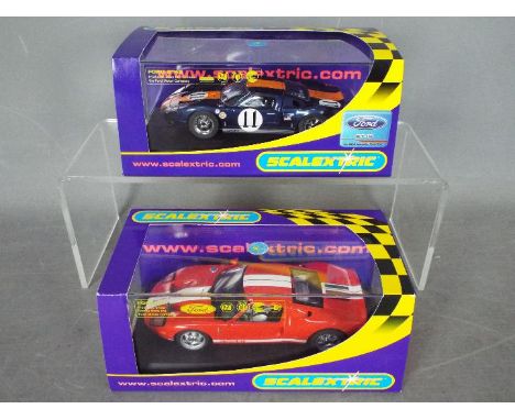 Scalextric - 2 x cars, a Ford GT Top Gear Stig model and a GT40 in Gulf racing livery. # C2661, # C2755. Both models appear M