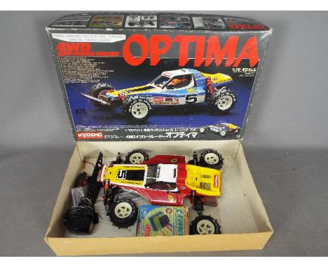 Kyosho - A boxed vintage Radio Controlled Kyosho original release (circa mid 1980's)  Model #3032 1:10 scale Optima 4WD Off R