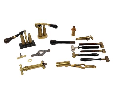 A collection of 19th Century shotgun equipment, to include: five powder measures; a decapper and capper cartridge reloading t