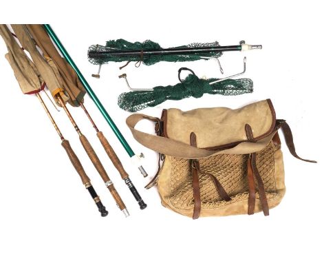 A canvas fishing tackle bag containing a selection of split cane rods, by Mitre Hardy and others; and a landing net.