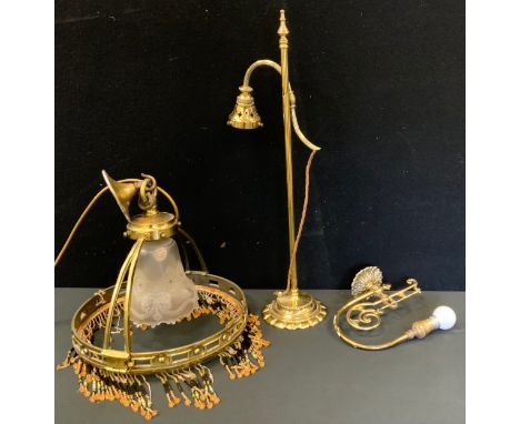 An early 20th brass ceiling light, beaded fringe, 30cm diam;  a brass side light;  a wall light (3) 