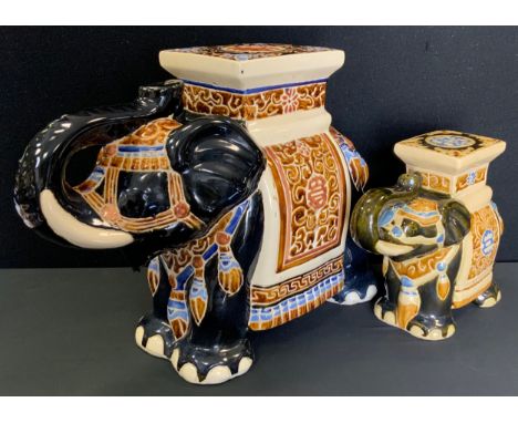 An oriental ceramic Elephant garden seat, 41cm high, 52cm long;  another smaller, 28cm high, 30cm long (2) 