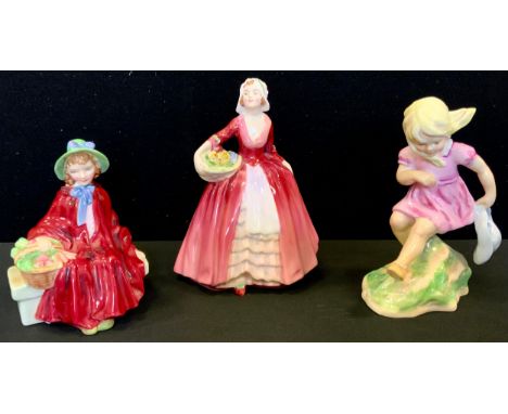 A Royal Worcester figure, modelled by Freda Doughty, March, 3454;  a Royal Doulton figure, Linda, HN2106;  Janet, HN1537 (3) 