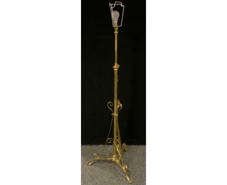An early 20th century brass rise-and-fall standard lamp. 
