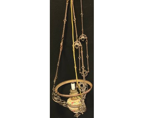 A 19th century Dutch light fitting, pottery reservoir, metal fittings, adjustable height fittings 