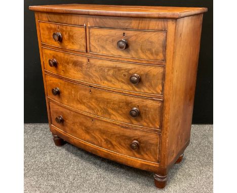 A Victorian mahogany bow-front chest of drawers, two short over three graduated long drawers, turned handles and legs, 117cm 