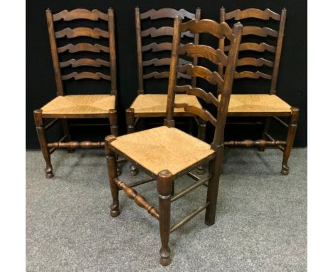 A set of four 19th century ladder-back country house kitchen chairs, rush seats, (4). 