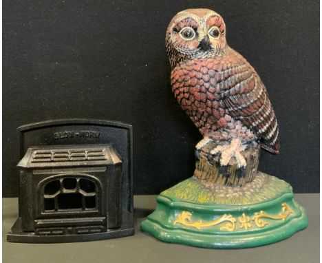 A Wright Studios cast iron door stop, as an Owl, 30cm high, 24.5cm wide;  a Gloworm advertising cast iron letter rack, as a f