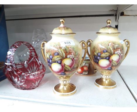A pair of Aynsley porcelain vases with covers and fruit decoration signed 'K Jones', height 21.5cm, together with a similar t