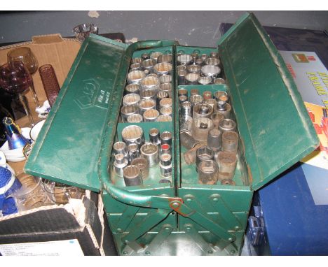 A metal toolbox containing sockets 